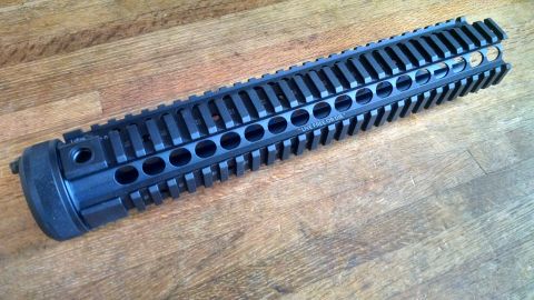1996 Ford Bronco - A black rifle handguard with "LIVE FREE OR DIE" inscribed is shown on a wooden surface.