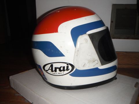 1966 Ford Bronco - Arai helmet with red and blue racing stripes sits on a box.