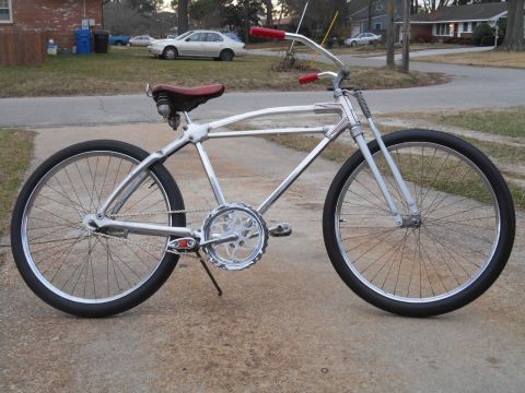 1994 Ford Bronco - A custom cruiser bicycle with a distinctive frame design and chrome accents is shown from the side.