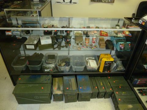 1992 Ford Mustang - A retail store display features shelves stocked with merchandise and storage containers on the floor.