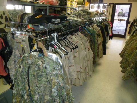 1992 Ford Mustang - Store interior displaying camouflage apparel and accessories on racks.