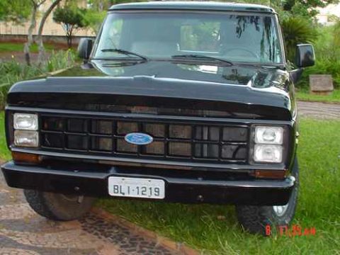 1970 Ford F-100 - This black Ford F-Series truck features a distinctive grille and dual headlights.