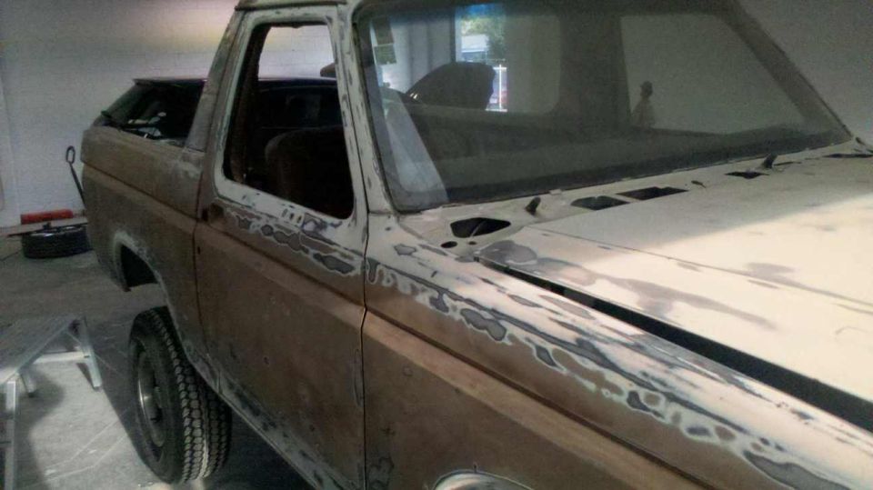 1982 Ford Bronco with body filler on the fender and door