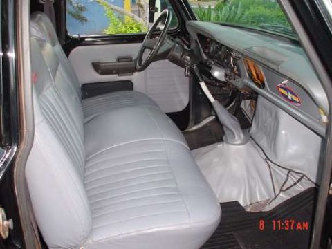 1970 Ford F-100 - The interior of a 1970 Ford F-100 shows a bench seat, dashboard, and steering wheel.