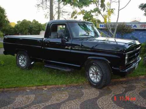 1970 Ford F-100 - This black 1970 Ford F-100 pickup truck is shown from a 3q-front angle.