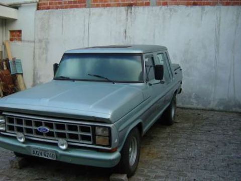 1970 Ford F-100 - This light blue Ford F-Series truck is parked in front of a concrete wall.