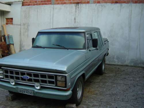 1973 Ford F-Series truck, light blue, parked outdoors