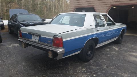 1991 Ford LTD Crown Victoria - This Ford Crown Victoria has a two-tone paint scheme and appears to be from the 1980s, not a 1991 model.