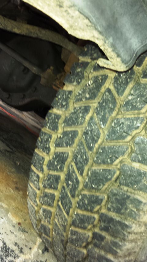 2001 Ford F-150 - Undercarriage view showing a tire and suspension components.