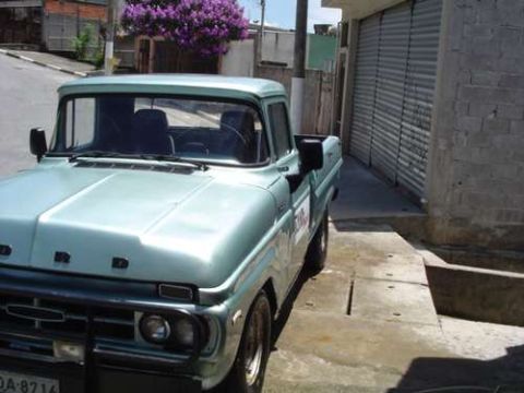 1970 Ford F-100 - This pickup truck is parked on a concrete surface. The license plate is visible.