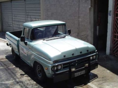 1970 Ford F-100 - This light blue 1967 Ford F-100 pickup truck is seen from a 3/4 front angle.