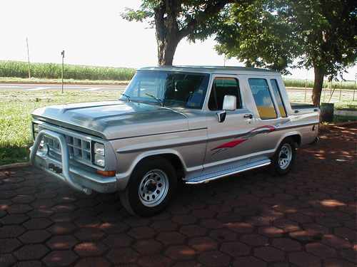 1970 Ford F-100 pickup truck with a bull bar and custom side graphics