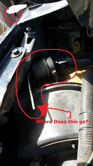 1990 Ford Bronco - Unidentified engine bay part circled in red, with a question about its placement.