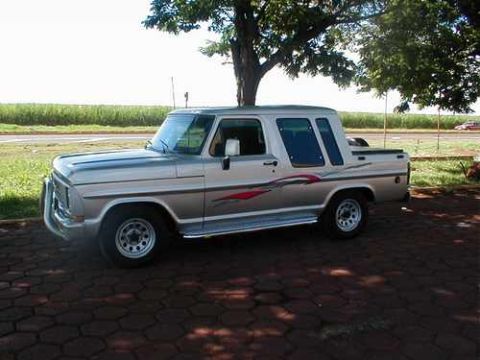 1970 Ford F-100 - This pickup truck features a distinctive body style with a crew cab and a short bed.