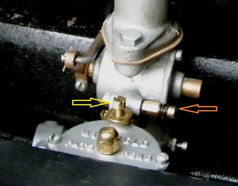 1915 Ford Model T - Close-up view of a carburetor component, showing intricate metalwork and adjustment points.