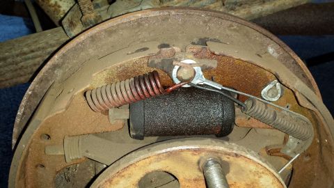1978 Ford Bronco - Drum brake assembly showing wear and rust on components.
