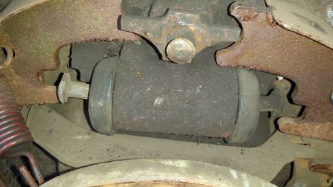 1978 Ford Bronco - This is a close-up view of a brake wheel cylinder, a component of a vehicle's braking system.