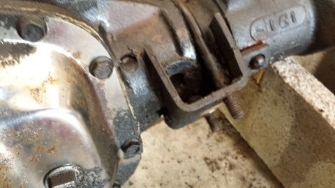 1978 Ford Bronco - Close-up of a metal differential housing part, showing bolts and surface wear.