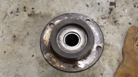 1978 Ford Bronco - A close-up view of a wheel hub assembly, likely from an older vehicle, showing wear and grease.