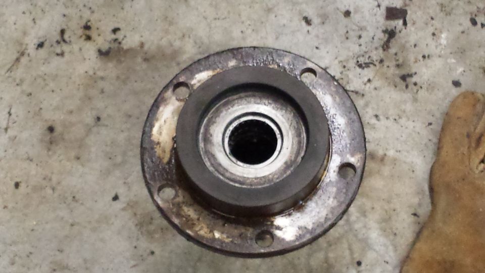 Wheel hub assembly with four bolt holes and a central bearing race