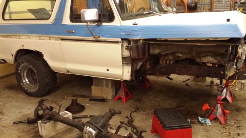 1978 Ford Bronco - This 1978 Ford Bronco is undergoing repairs with its front end disassembled and supported by jack stands.