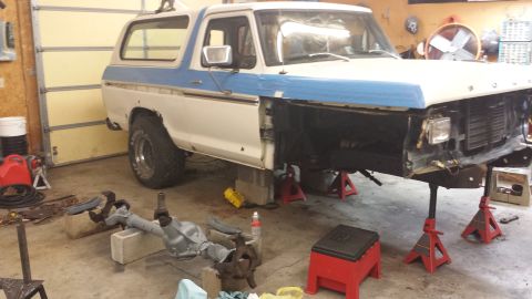 1978 Ford Bronco - This 1978 Ford Bronco is undergoing front-end repairs in a garage.