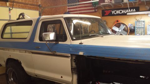 1978 Ford Bronco - This 1978 Ford Bronco is undergoing some work in a garage, with blue tape applied to the body panels.