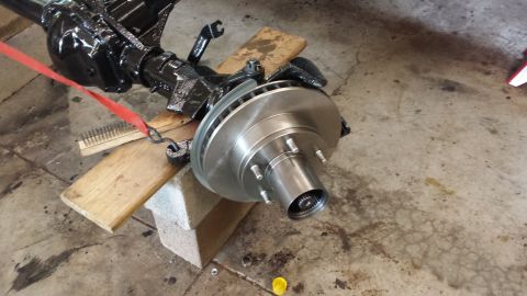 1978 Ford Bronco - Front axle assembly with brake rotor and hub, likely for a truck or SUV.