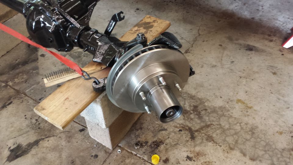 Front axle assembly with brake rotor and hub