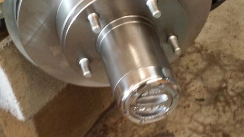 1978 Ford Bronco - A close-up view of a vehicle's wheel hub and brake rotor, with visible text on the hub.