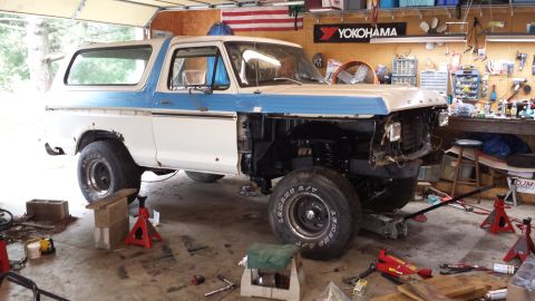 1978 Ford Bronco - This 1978 Ford Bronco is undergoing repairs in a garage, with its front end disassembled.