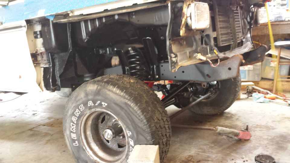 1978 Ford Bronco front wheel and suspension, undergoing repair