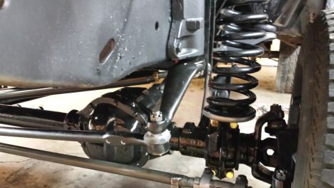 1978 Ford Bronco - Close-up view of the front suspension and steering system of a vehicle.