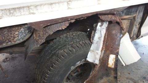 1978 Ford Bronco - Severe rust damage is visible on the frame and wheel well of this vehicle.