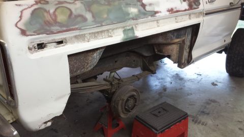 1978 Ford Bronco - The rear section of a 1978 Ford Bronco is shown with visible rust and bodywork in progress.