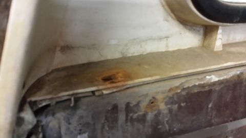 1978 Ford Bronco - This image shows significant rust and dirt buildup in the interior of a vehicle, indicating potential wear and tear.