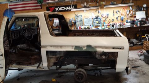 1978 Ford Bronco - This Bronco is undergoing restoration in a workshop with tools on the wall.