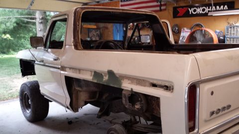 1978 Ford Bronco - This Ford Bronco is undergoing restoration, with parts removed and visible wear and tear.
