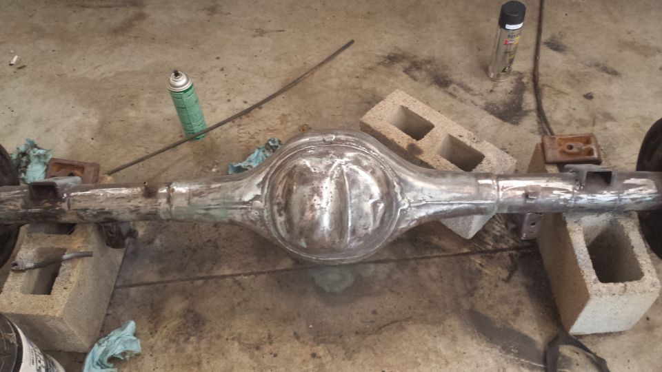 Rear axle assembly on cinder blocks, undergoing restoration