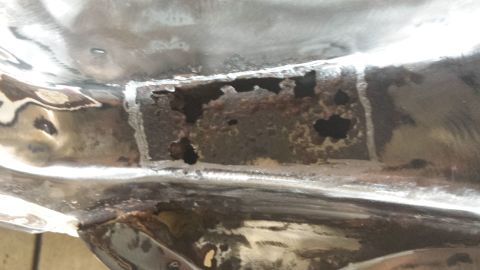 1978 Ford Bronco - This image shows significant rust damage on a vehicle's metal frame, indicating structural compromise.