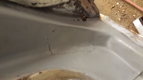 1978 Ford Bronco - Close-up view of an interior wheel well showing signs of rust and previous repair work.
