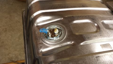1978 Ford Bronco - Fuel tank sender unit assembly with blue tape on the electrical connector.
