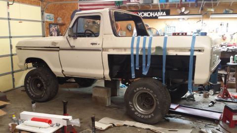 1978 Ford Bronco - This Ford F-Series truck is in a garage, possibly being prepped for paint or bodywork.