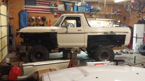 1978 Ford Bronco - This 1978 Ford Bronco is undergoing repairs in a cluttered garage.