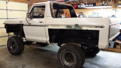 1978 Ford Bronco - This 1978 Ford Bronco is undergoing restoration, missing its front fenders and showing signs of body repair.