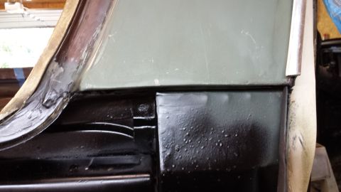1978 Ford Bronco - Detail shot of a vehicle's lower body panel, showing some texture and a seam with another panel.
