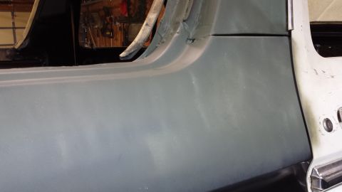 1978 Ford Bronco - Vehicle body panel primed and ready for paintwork, showing repair progress.