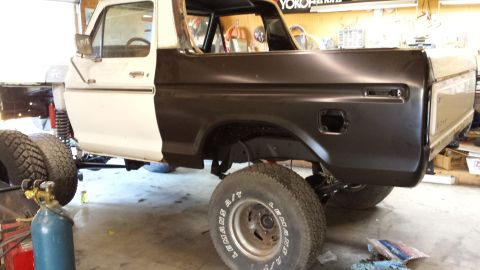 1978 Ford Bronco - This 1978 Ford Bronco is in a garage, appearing to be in the process of bodywork or restoration.