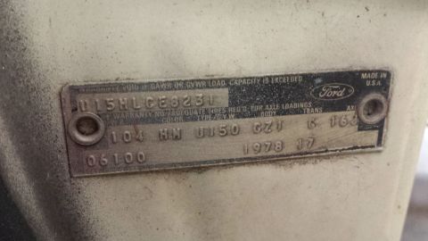 1978 Ford Bronco - Close-up of a 1978 Ford VIN plate showing vehicle identification and manufacturing information.