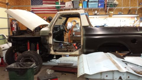 1978 Ford Bronco - This truck is in a garage with the hood and doors open, appearing to be under repair.
